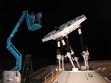 Pictures of a number of targets on the platform are taken from the basket of a cherry picker, while the hexapod is driven to different elevations. Relative positions of the targets provide a measure of the deformation of the platform.