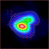 Magnetic field vectors shown in red as measured in dust polarization by the SMA