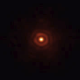 Image of a Mag 8.1 star with AO off and on with FlyEyes.