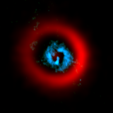 ALMA image of the dust ring (red) and gaseous spirals (blue) of the circumstellar disk AB Aurigae.