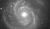 The installation of the TAOS II telescopes was completed in 2017 October. This image of the galaxy M100 is the first image we acquired with one of the three new telescopes.