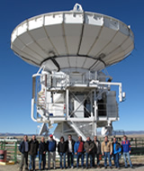 Some of the key people associated with the Greenland Telescope (GLT) project posting in front of the ALMA NA prototype antenna.The GLT project will retrofit and redeploy this antenna to Greenland. Several of the major antenna components require new design, revision, or retrofitting to survive the extreme cold environment, on the ice sheet of Greenland. This project, with the antenna located in US now and moved to Greenland later, posts some great challenge in management and technology that we have never faced before.