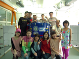 EA-FEIC staff members celebrating the delivery of the last receiver front-end system for our ALMA-Japan partner (blue cylinder-shaped object in the middle of the photo).