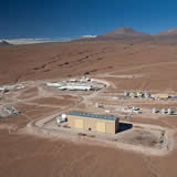 To the right are the three antenna assembly sites belonging to the Japanese, North American and European partners; in the upper middle section is the operations building, and in the upper right, the road to the Chajnantor Plain.