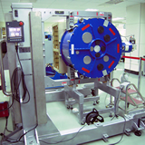 One of the front ends during testing and integration at the EA FEIC in Taichung, Taiwan. Pictured is the tilt table holding the cryogenic dewar (in blue) in which the receiver units are installed and tested.