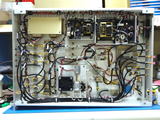Photo of upgraded Correlator 1st Down Converter (C1DC) unit.  This upgrade consisted of increasing the intermediate frequency (IF) signal bandwidth from 4-6 GHz to 4-16 GHz while maintaining the current function of the existing legacy correlator.  The upgrade is visible as the rectangular metal plate near the bottom center of the photo.  The upgrade consisted of two wide-band amplifiers, power divider, and filter along with a cooling fan.